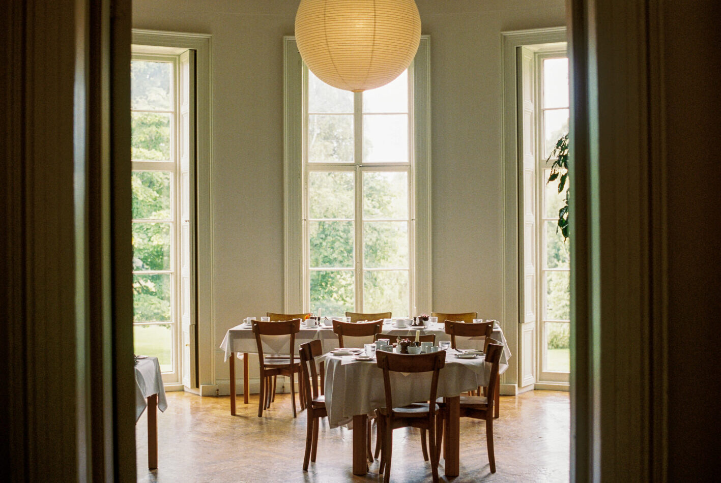 Boath House — the breakfast room with tall windows and a paper lantern