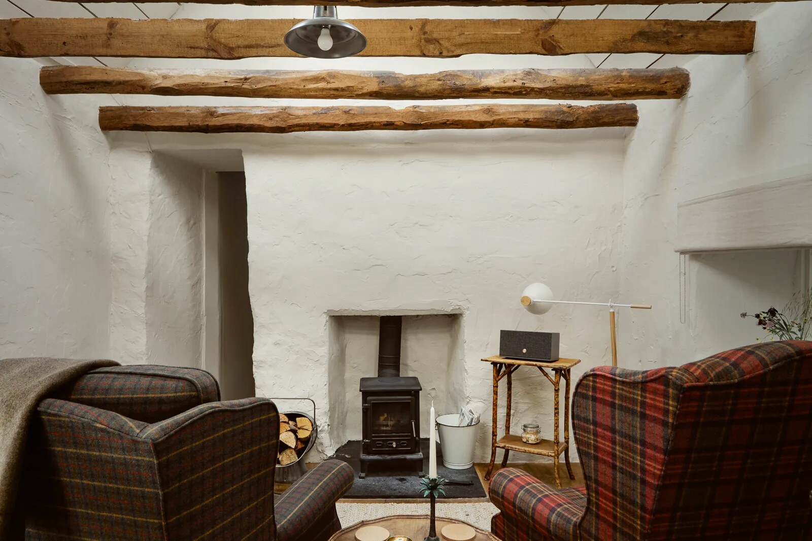 Boath House — the writing studio with wood stove and tartan chairs