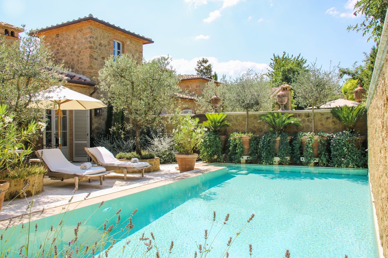 Borgo Santo Pietro &mdash; the pool and gardens within the stone hamlet