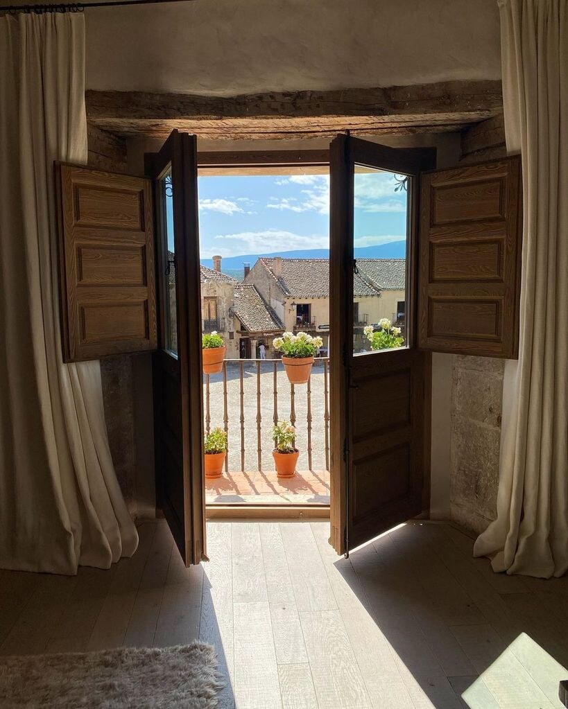 Casa Taberna — shuttered balcony doors opening onto the Plaza Mayor