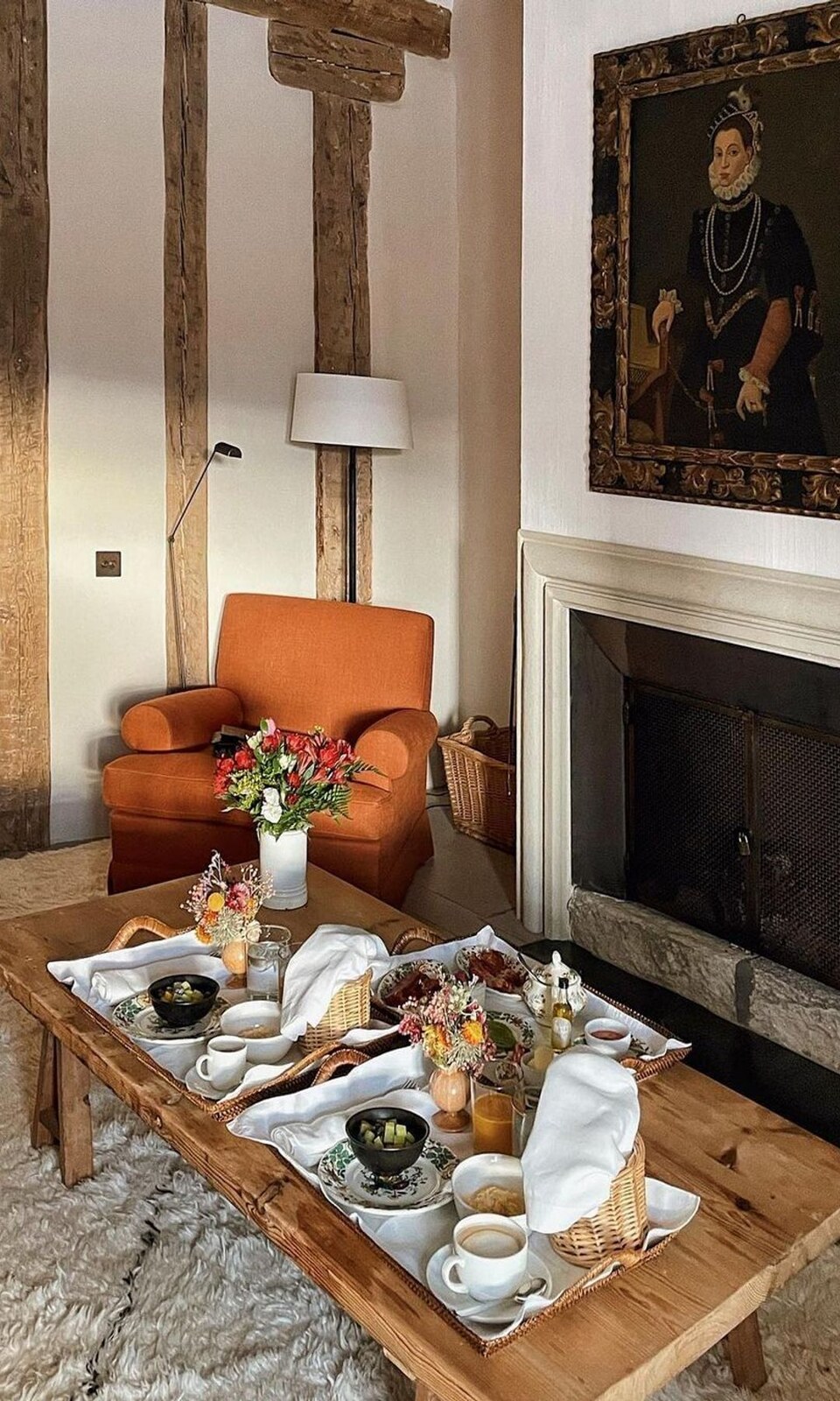Casa Taberna — sitting room with open fire, beamed walls and a breakfast tray