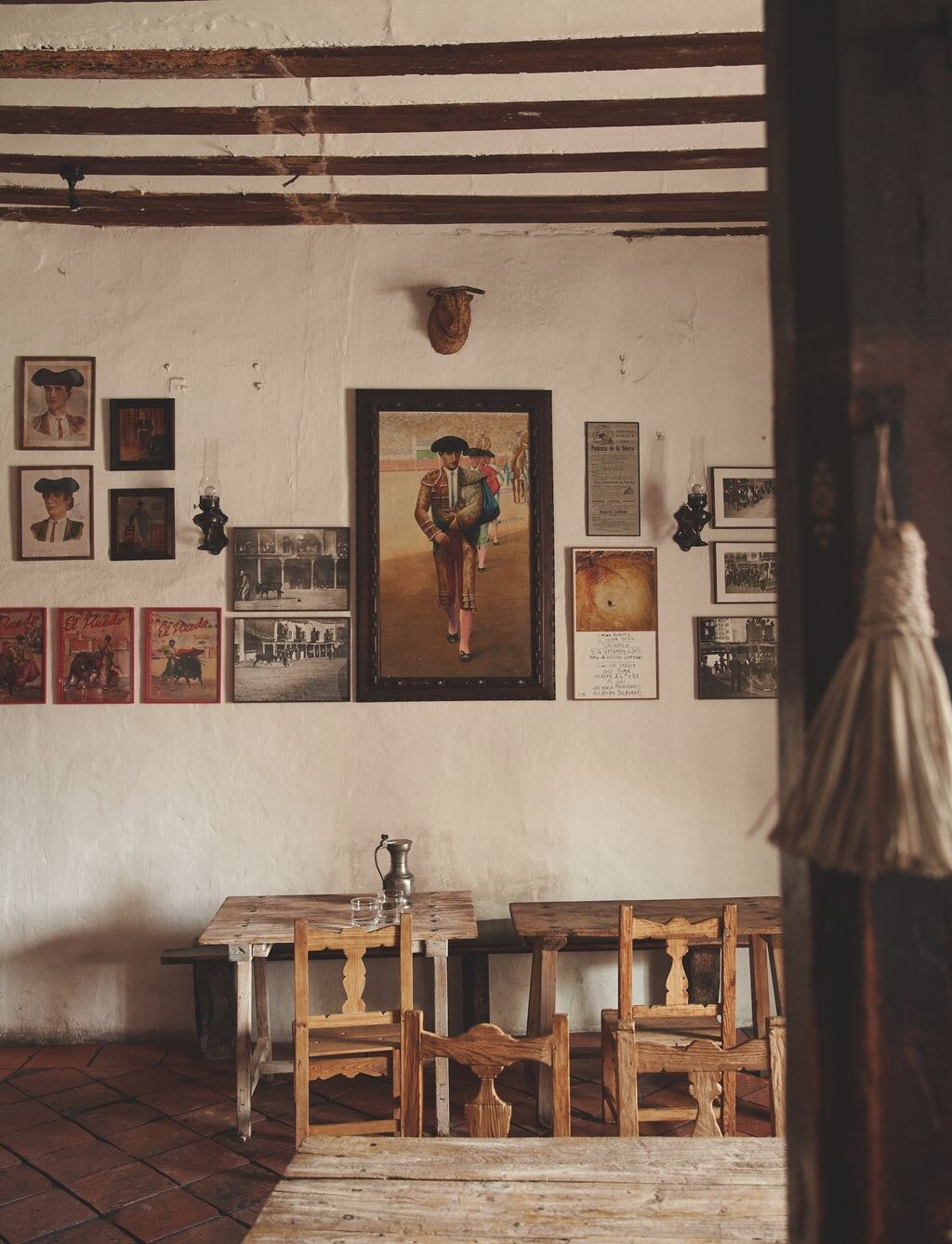 Casa Taberna — old tavern dining room hung with bullfighting prints