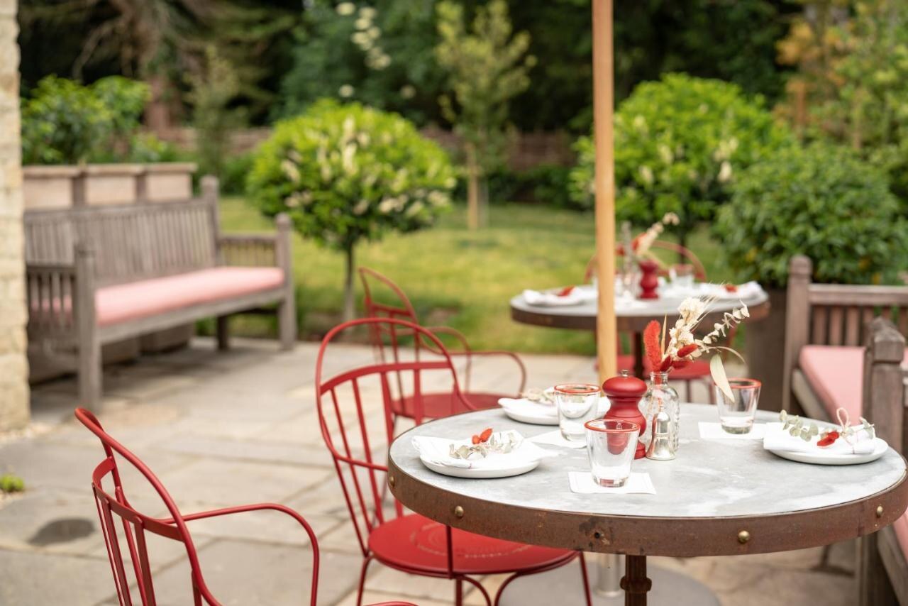 The Double Red Duke — the garden terrace set for tea