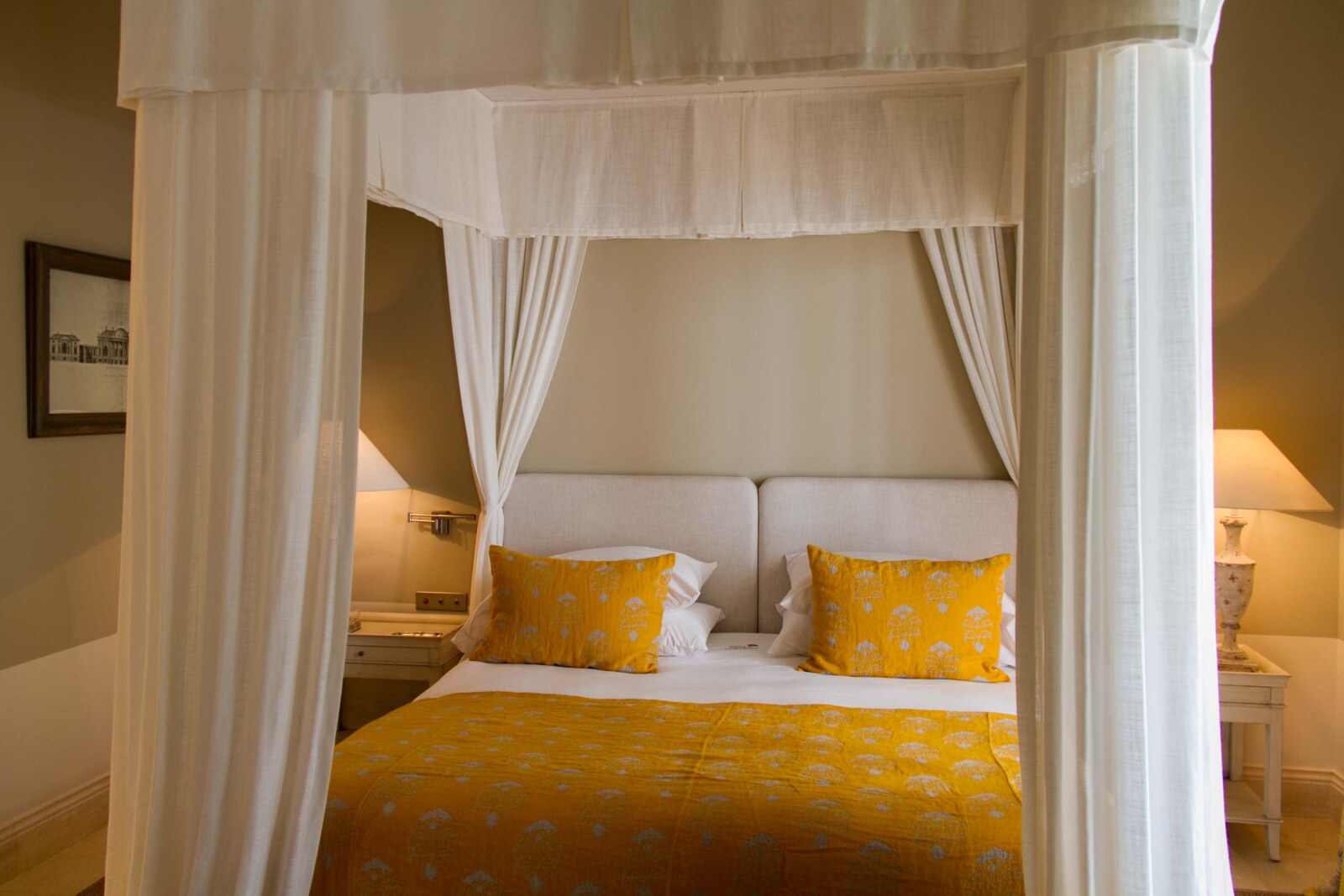 Finca Cortes&iacute;n &mdash; a canopy bed dressed in yellow
