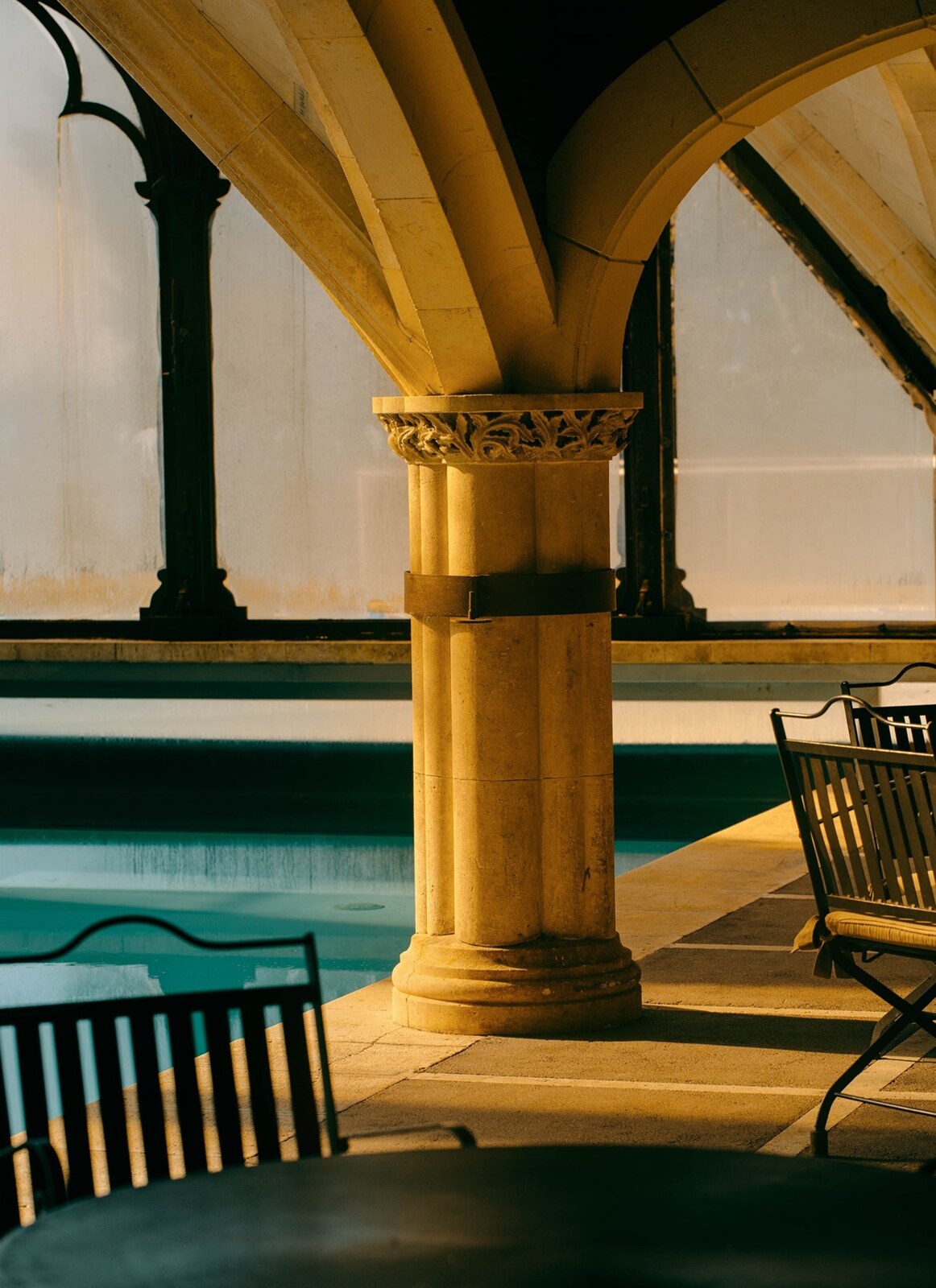 Hotel Landa &mdash; a golden stone column beside the vaulted pool