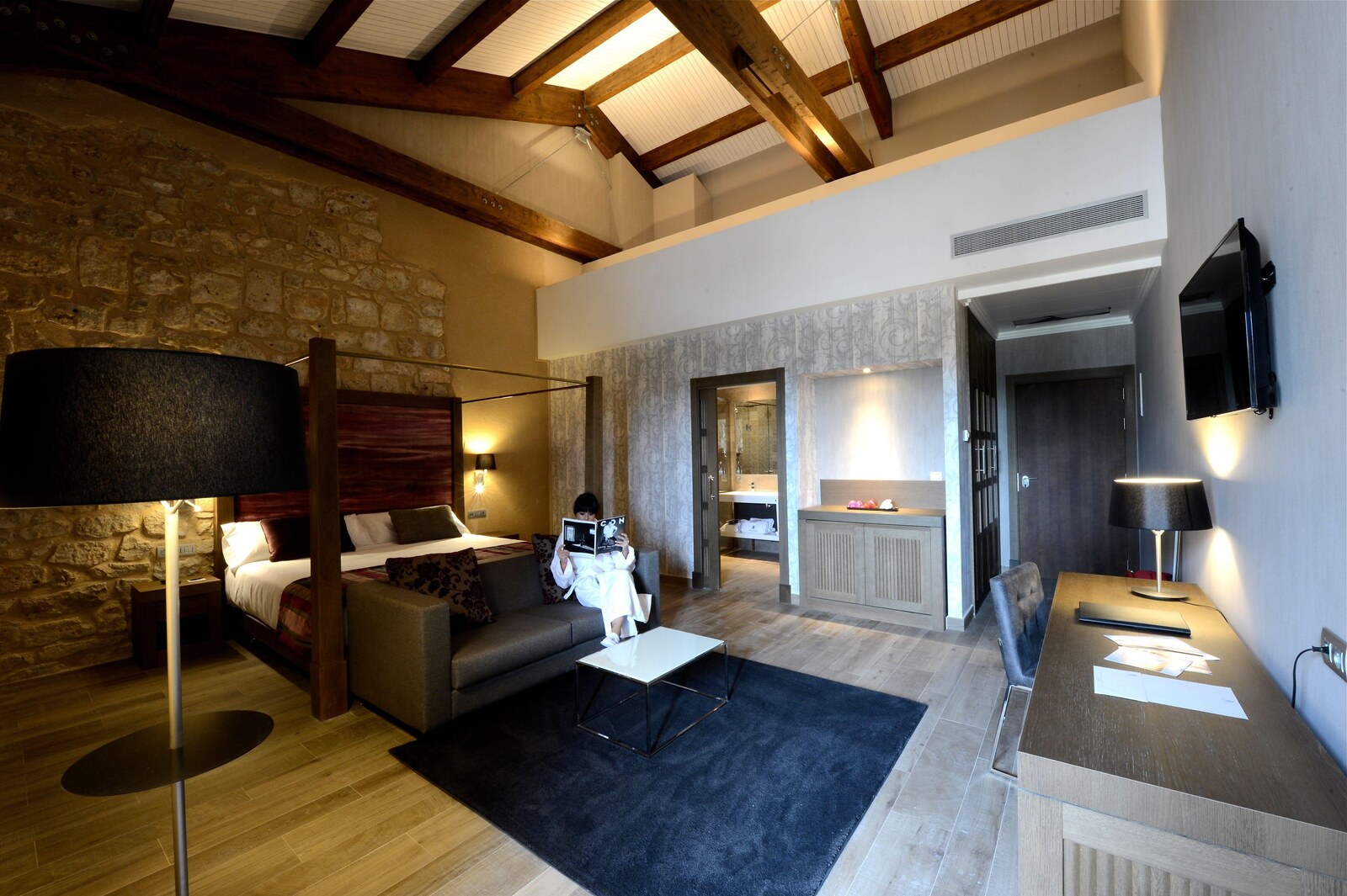 Castilla Termal Monasterio de Valbuena &mdash; a suite sitting room beneath the timber beams