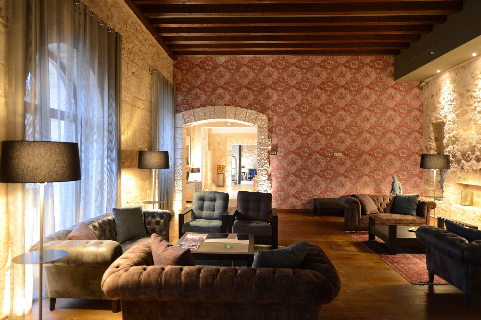 Castilla Termal Monasterio de Valbuena &mdash; the lounge with chesterfield sofas and damask walls