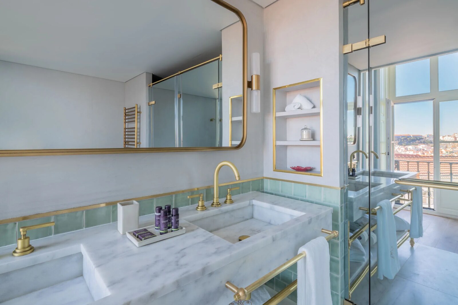 Pal&aacute;cio Ludovice &mdash; a marble bathroom with brass fittings