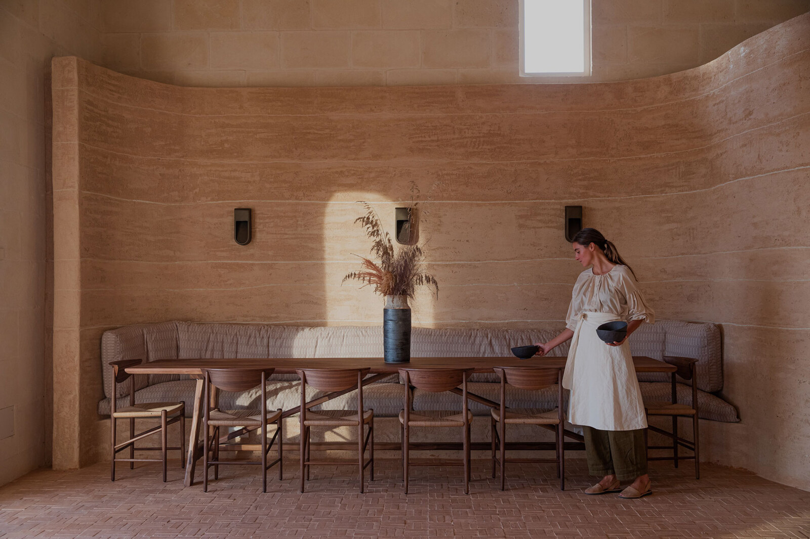 Son Blanc — rammed-earth dining room