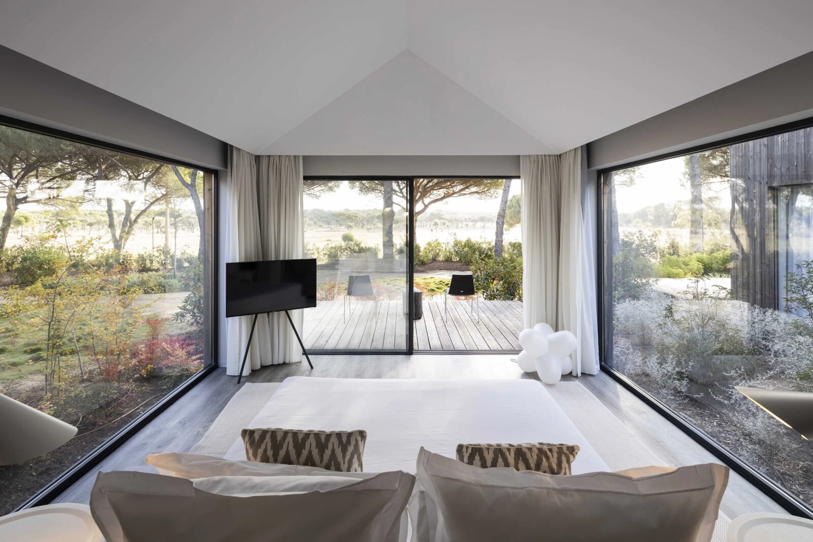 Sublime Comporta &mdash; a bedroom walled in glass, open to the pine forest
