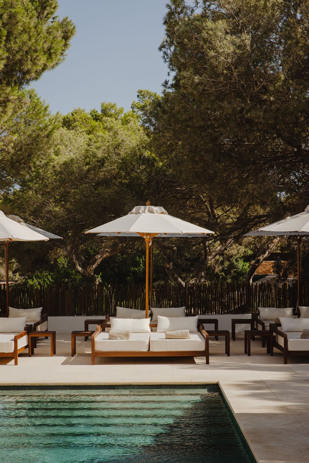 Teranka &mdash; sun loungers and a parasol beside the garden pool