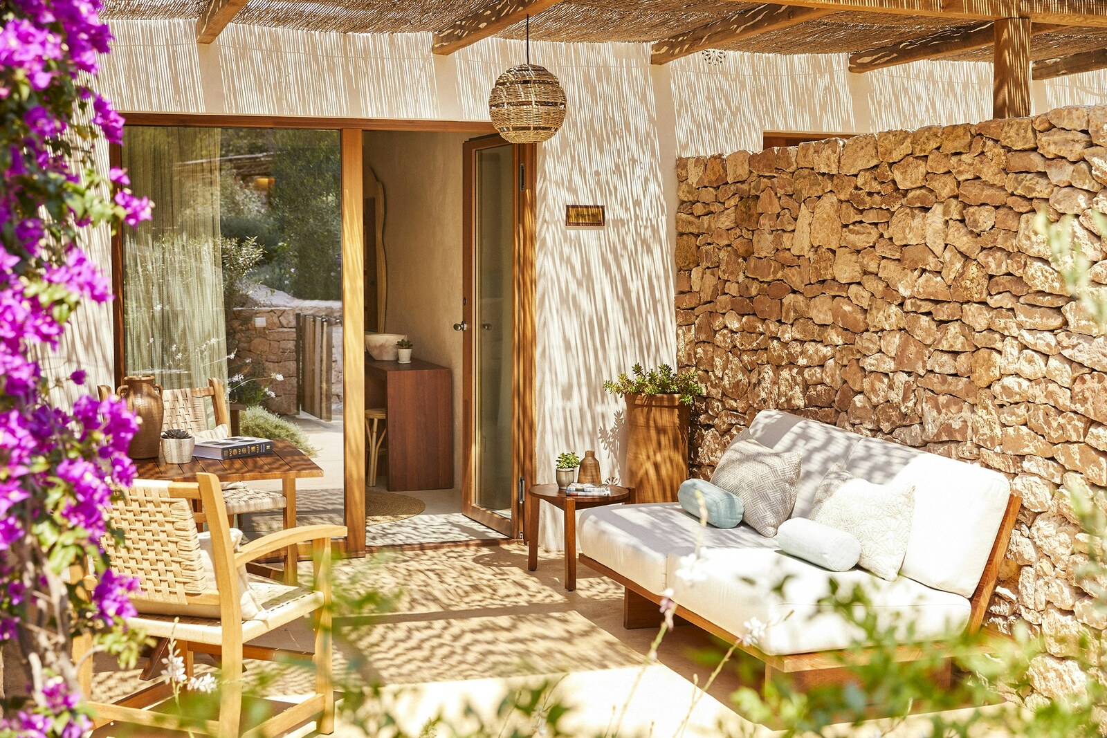 Teranka &mdash; a room terrace framed by bougainvillea and dry-stone walls