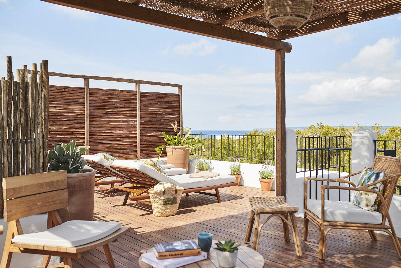 Teranka &mdash; a room terrace with loungers and a reed screen looking out to the sea