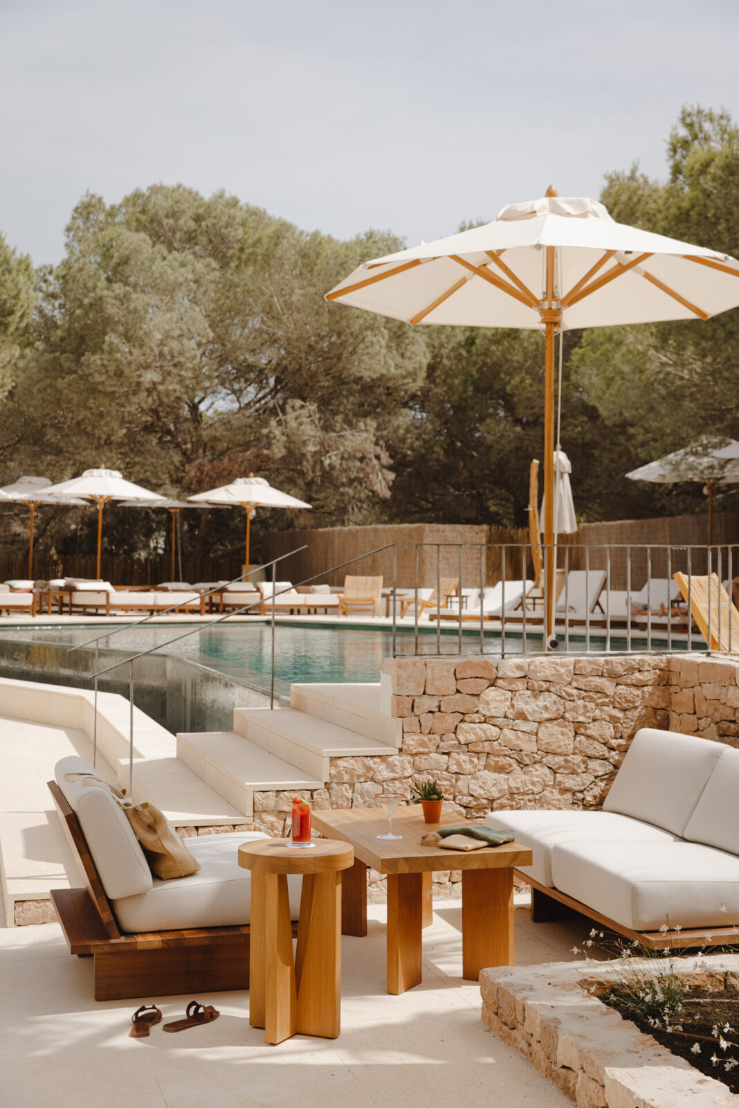 Teranka &mdash; cushioned sofas and a low table on the pool terrace