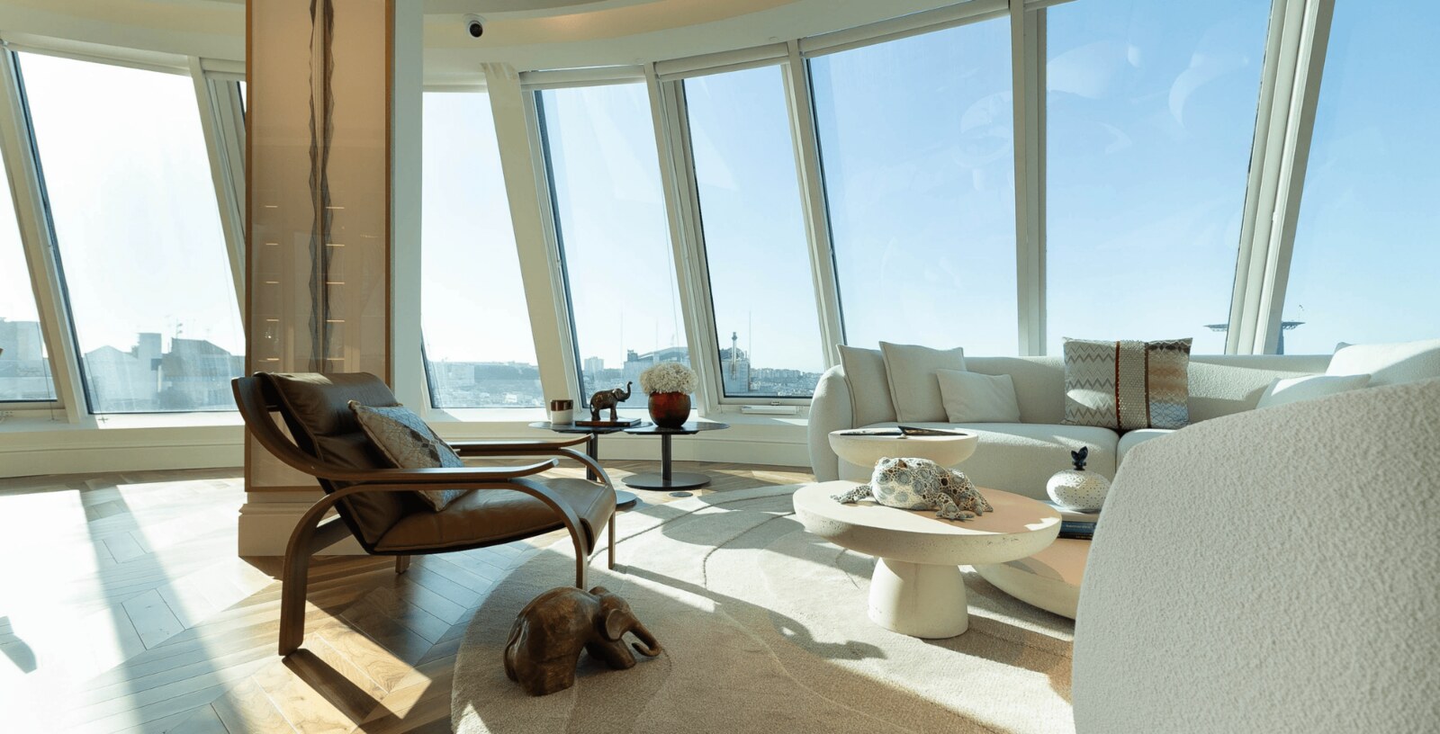 The Lumiares &mdash; the rooftop lounge, glazed to the city