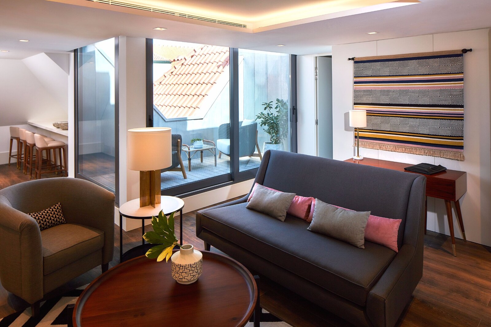 The Lumiares &mdash; a living room opening to the terracotta rooftops