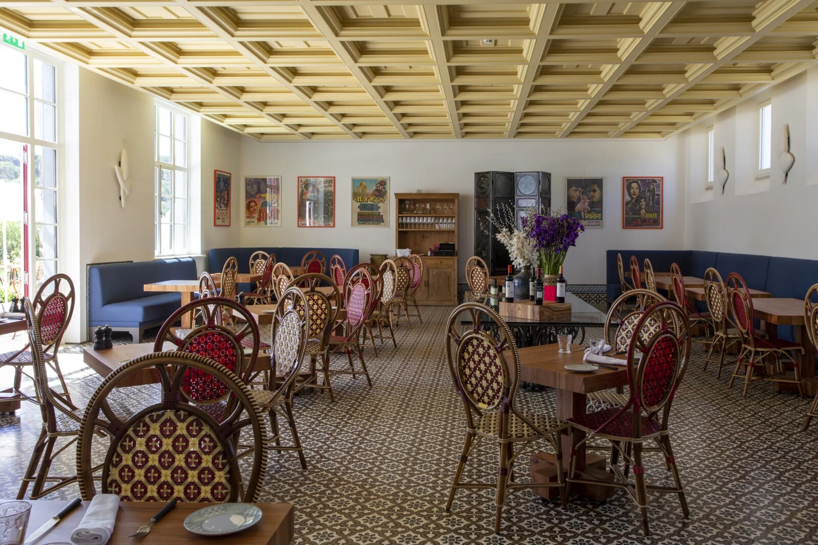 Vermelho Melides &mdash; the Xtian dining room, hung with art above blue banquettes
