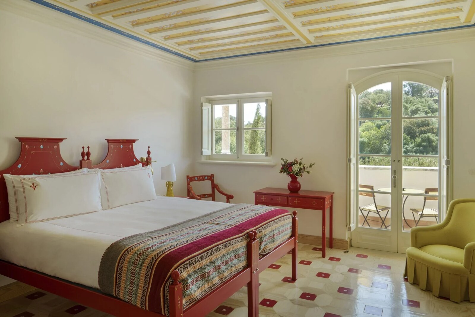 Vermelho Melides &mdash; a red-ceilinged bedroom opening to the garden