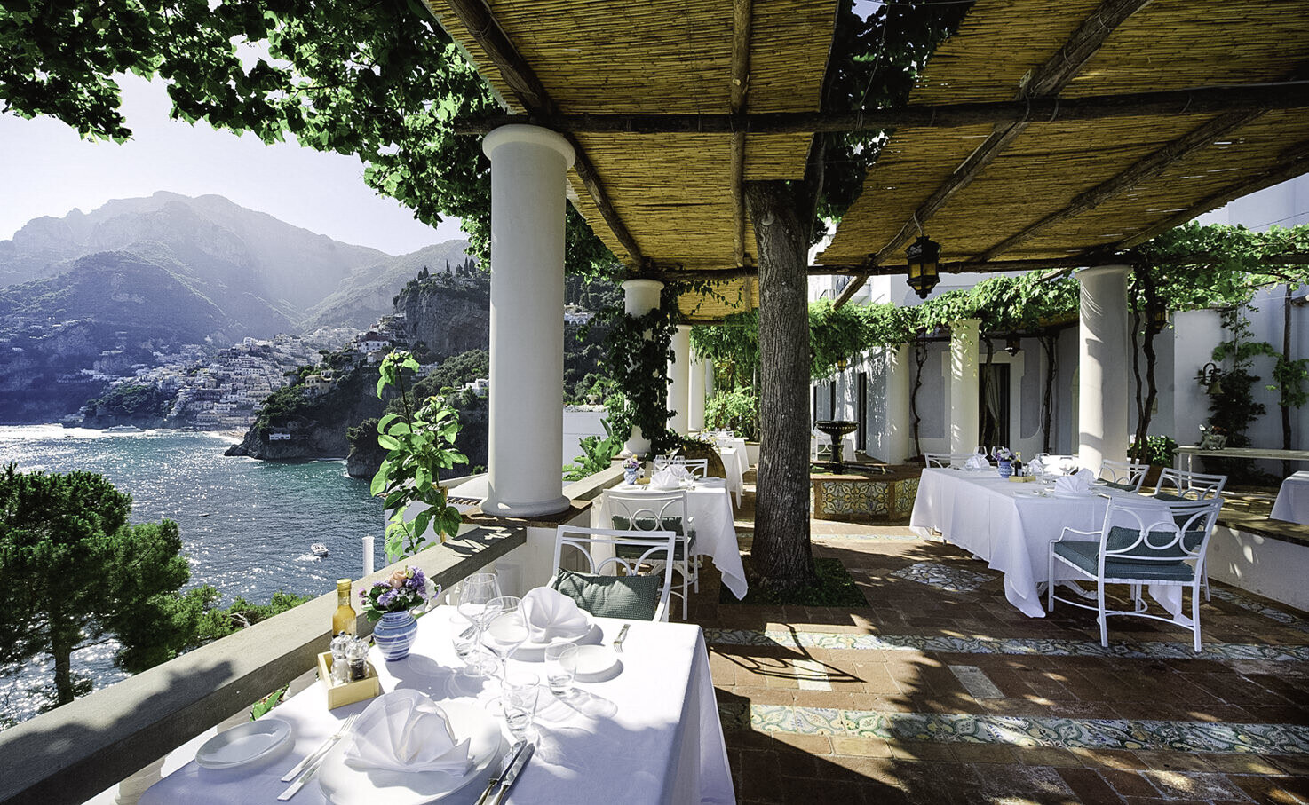 Villa Treville &mdash; a columned terrace laid for dinner over the gulf