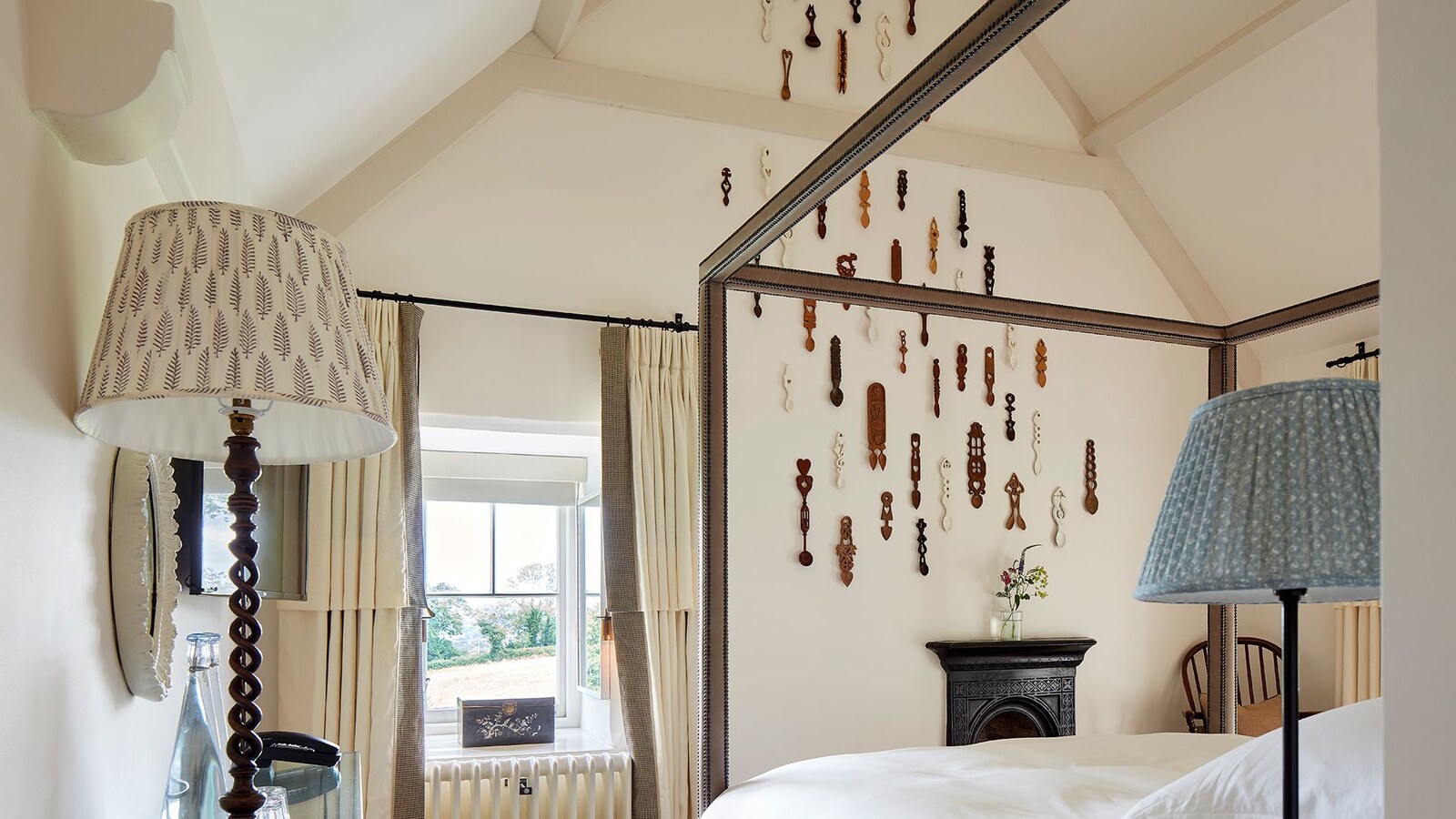 The Grove of Narberth — a bedroom hung with carved Welsh love spoons