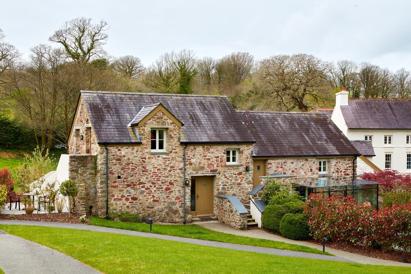 The Grove of Narberth — the restored stone longhouse in the grounds