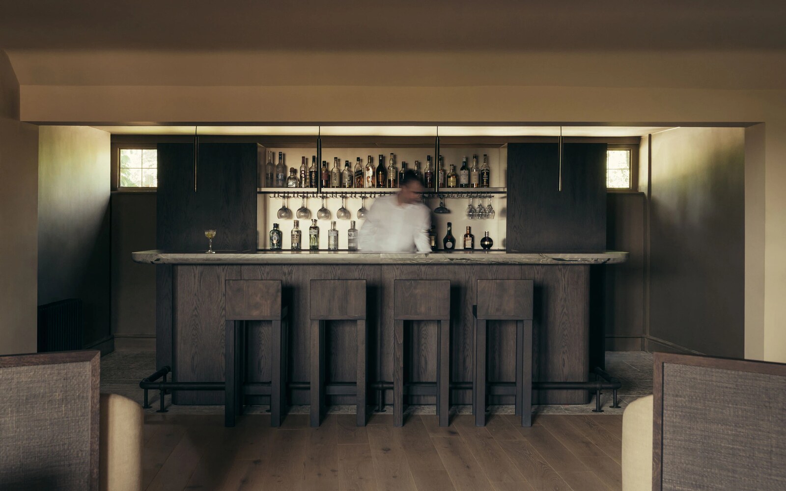 HYLL — the dark oak bar with marble counter