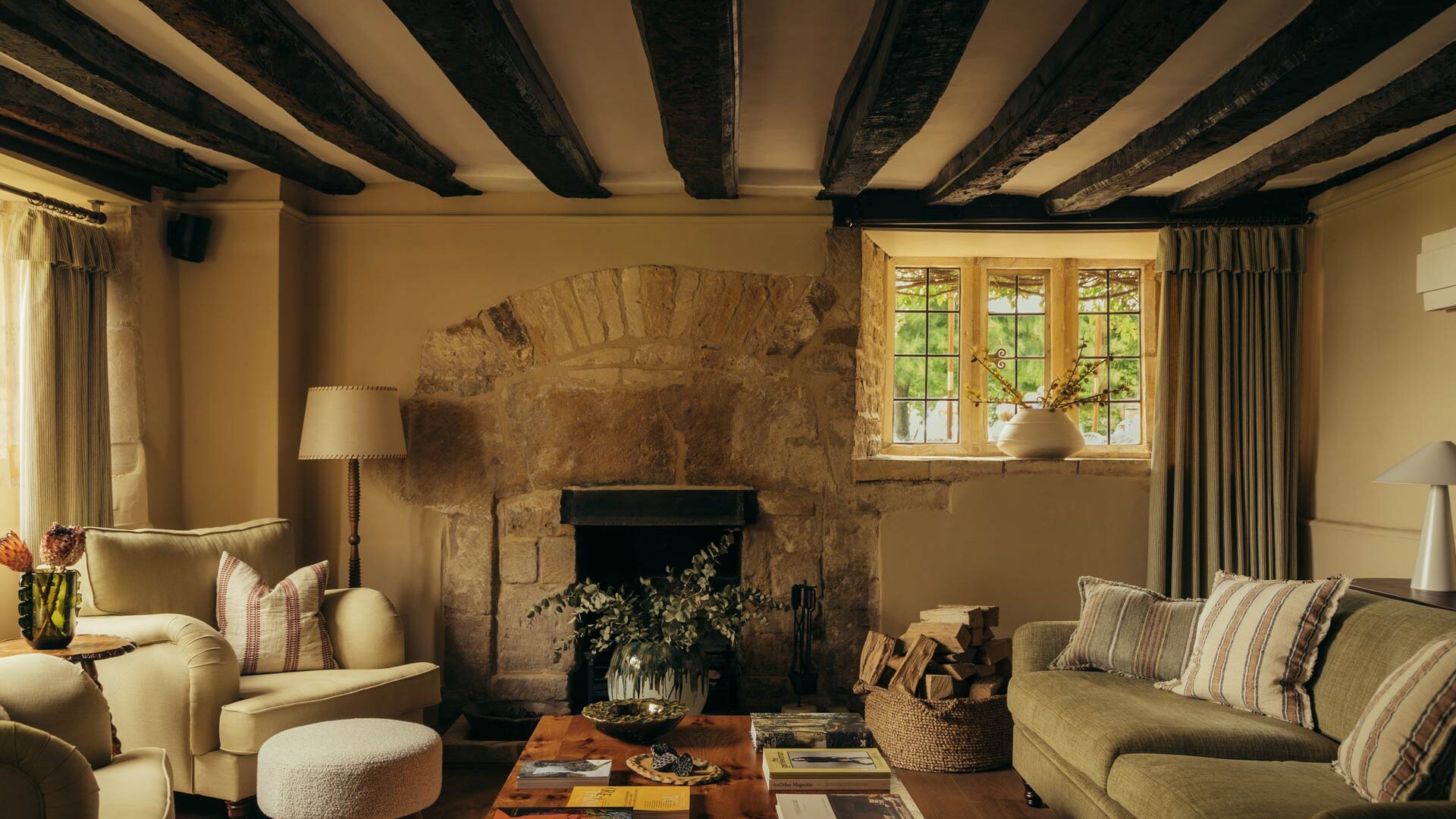 HYLL — the beamed sitting room with its stone fireplace