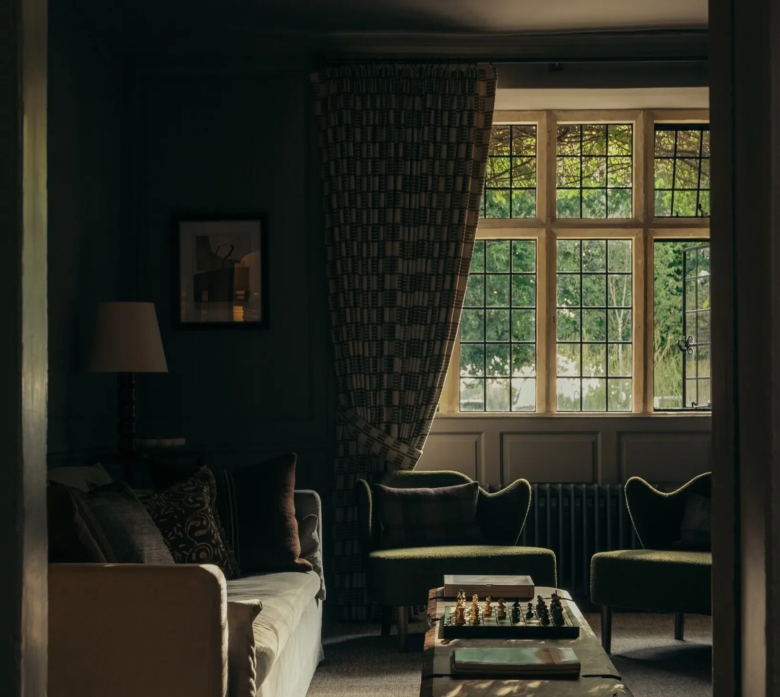HYLL — the dark green snug with leaded windows