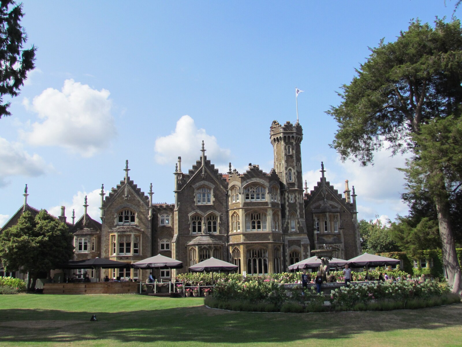 Oakley Court &mdash; the Gothic Victorian mansion across its Thames-side lawns