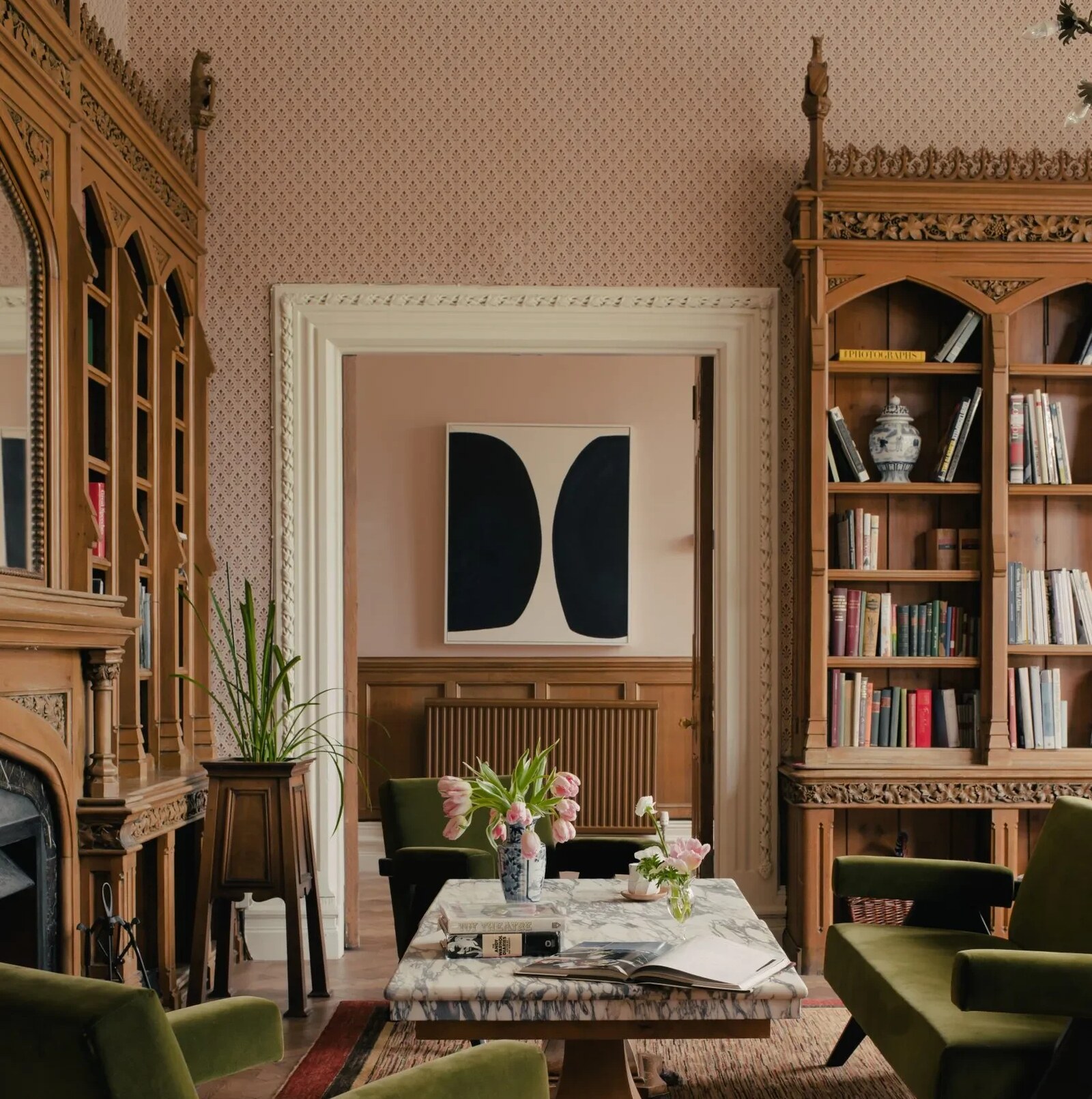 Oakley Court &mdash; panelled drawing room with Gothic bookcases