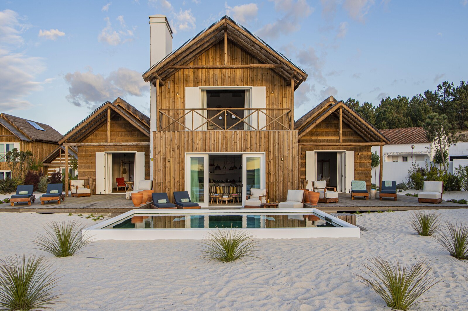 Quinta da Comporta &mdash; wooden villas and the pool under an open Alentejo sky