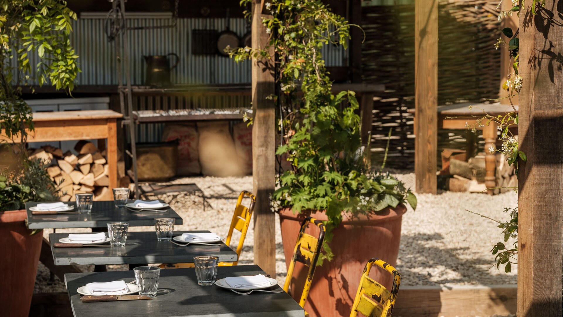 The Bull, Charlbury — the courtyard garden set for lunch under the vines