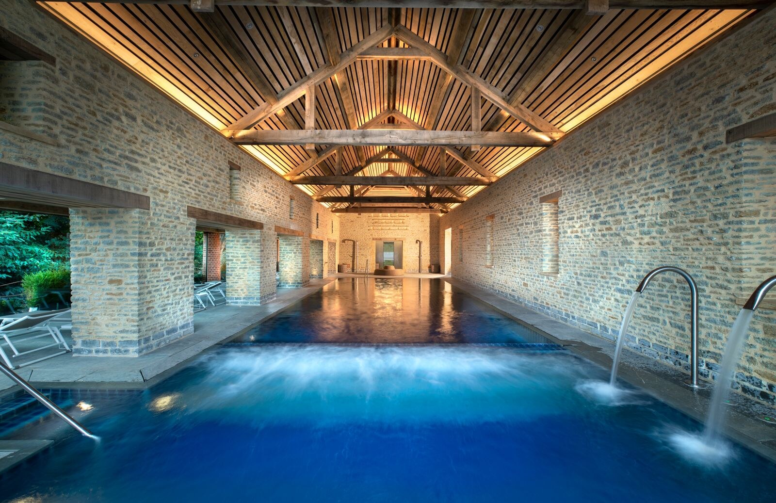 The Newt in Somerset — the spa pool beneath a beamed barn roof