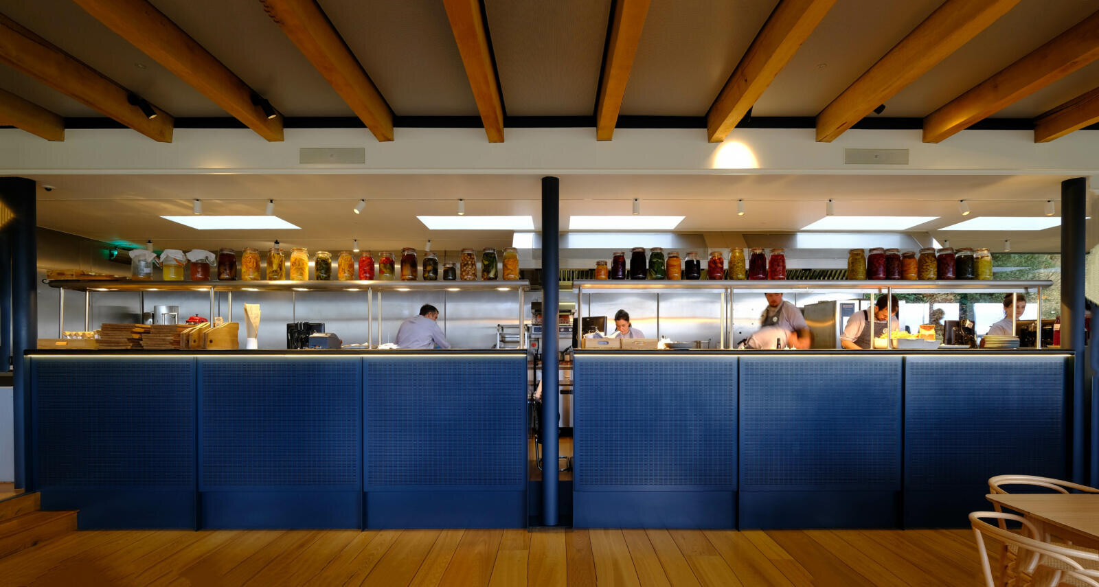 The Newt in Somerset — the open kitchen pass lined with the year's preserves